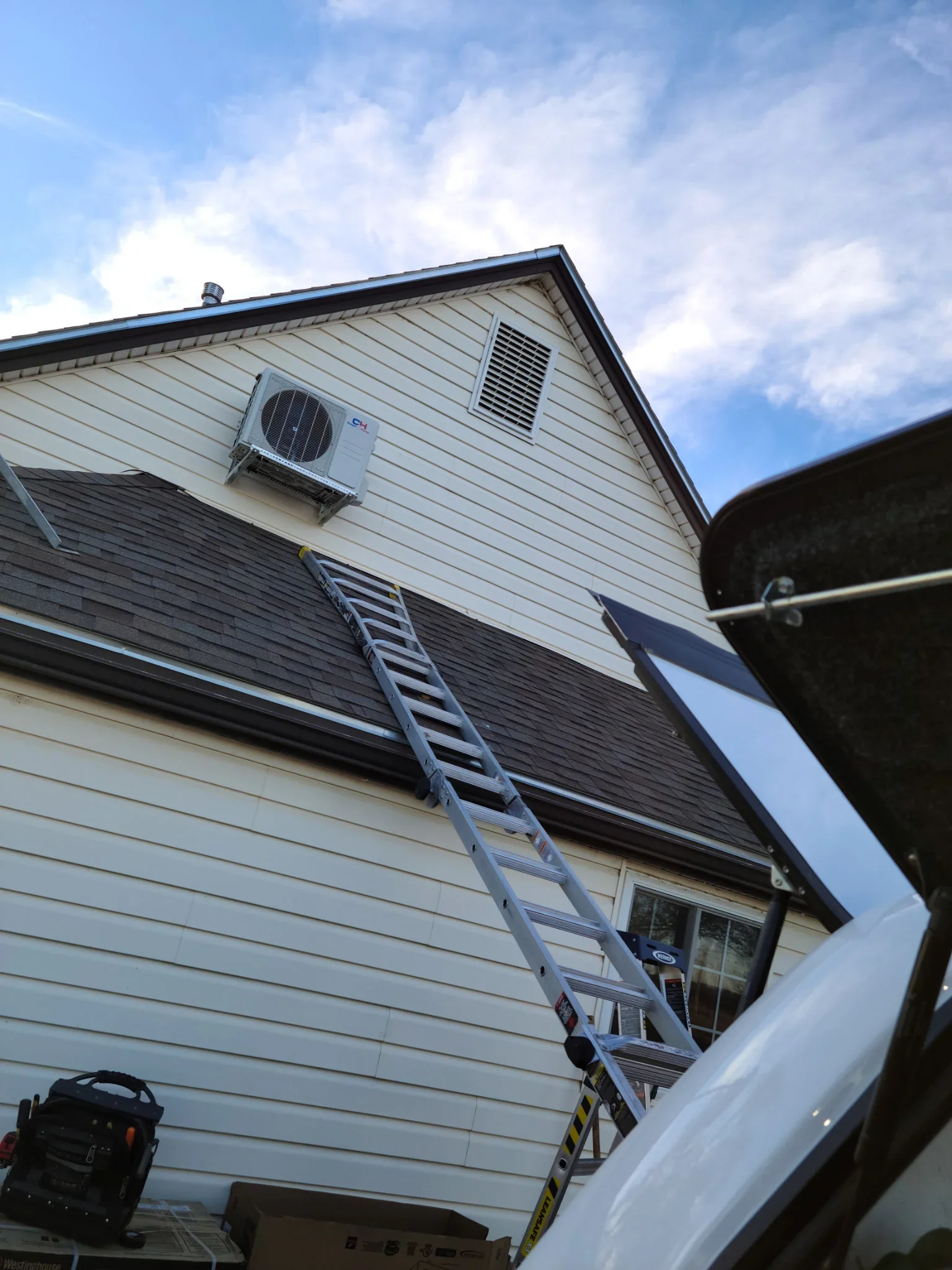 Ductless mini-split outdoor unit installed on residential home exterior wall in La Junta